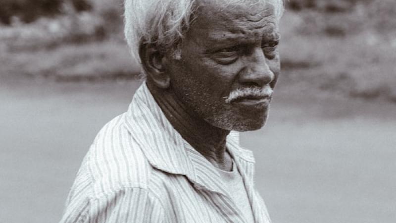 A distinguished elderly man in a portrait.