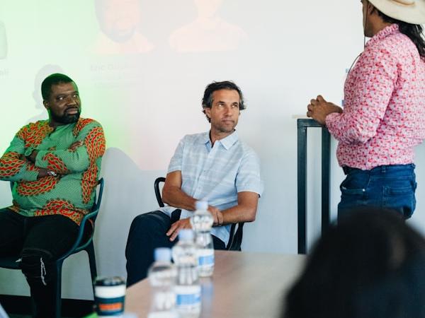 A panel discussion in a modern meeting room.