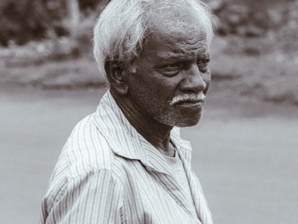 A distinguished elderly man in a portrait.