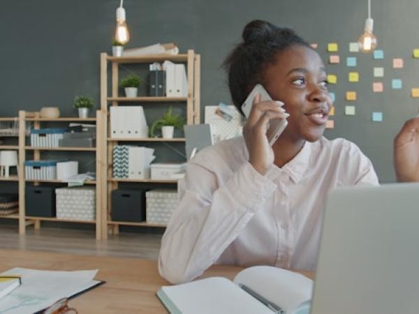 A professional working at a desk with a laptop.
